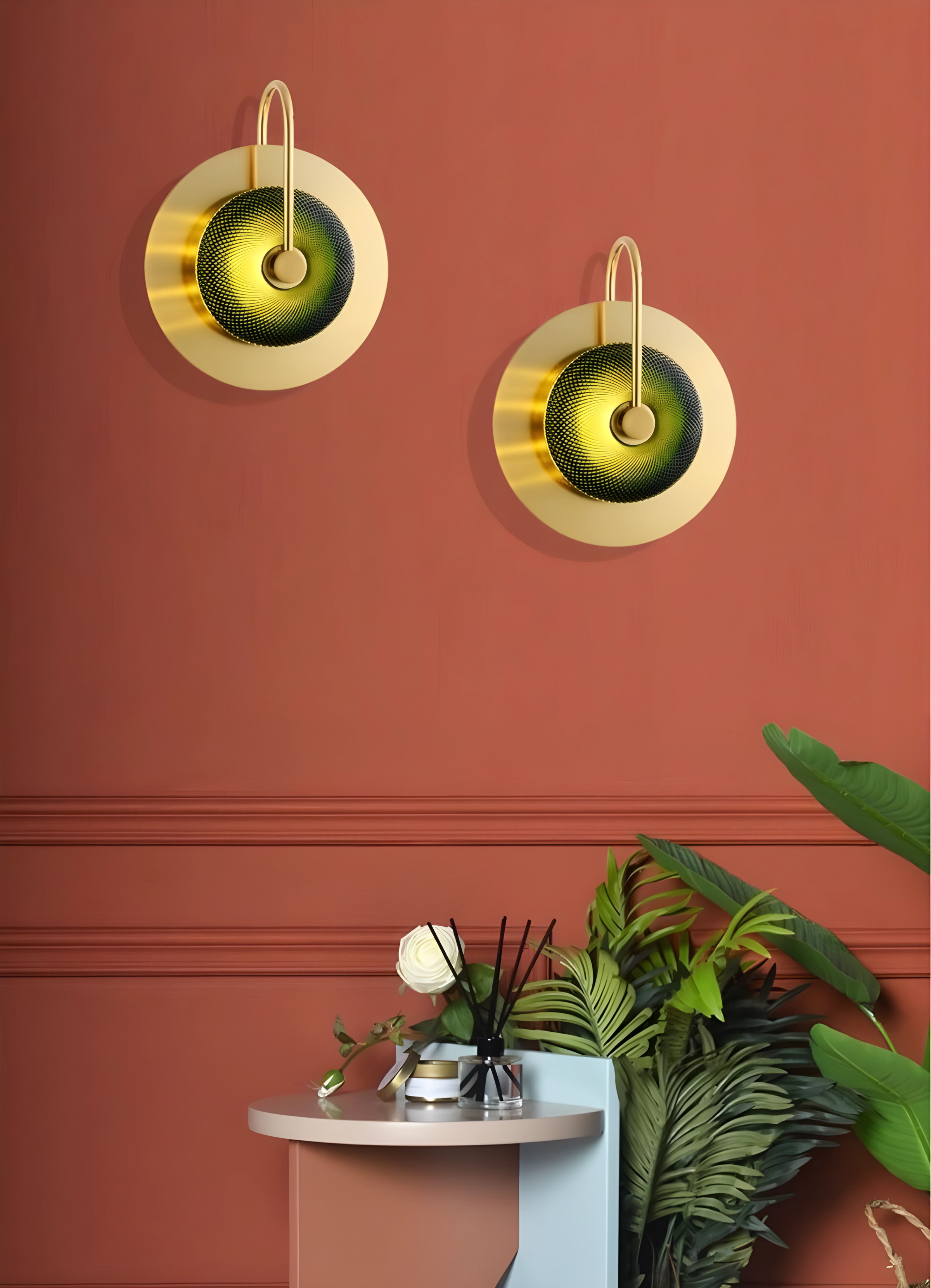 Elegant gold wall sconces on terracotta wall