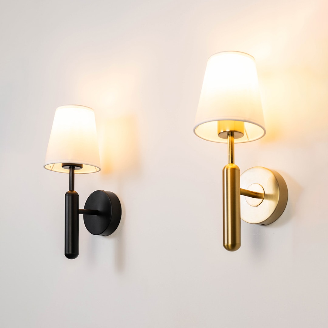 Modern black and gold wall sconces with fabric shades
