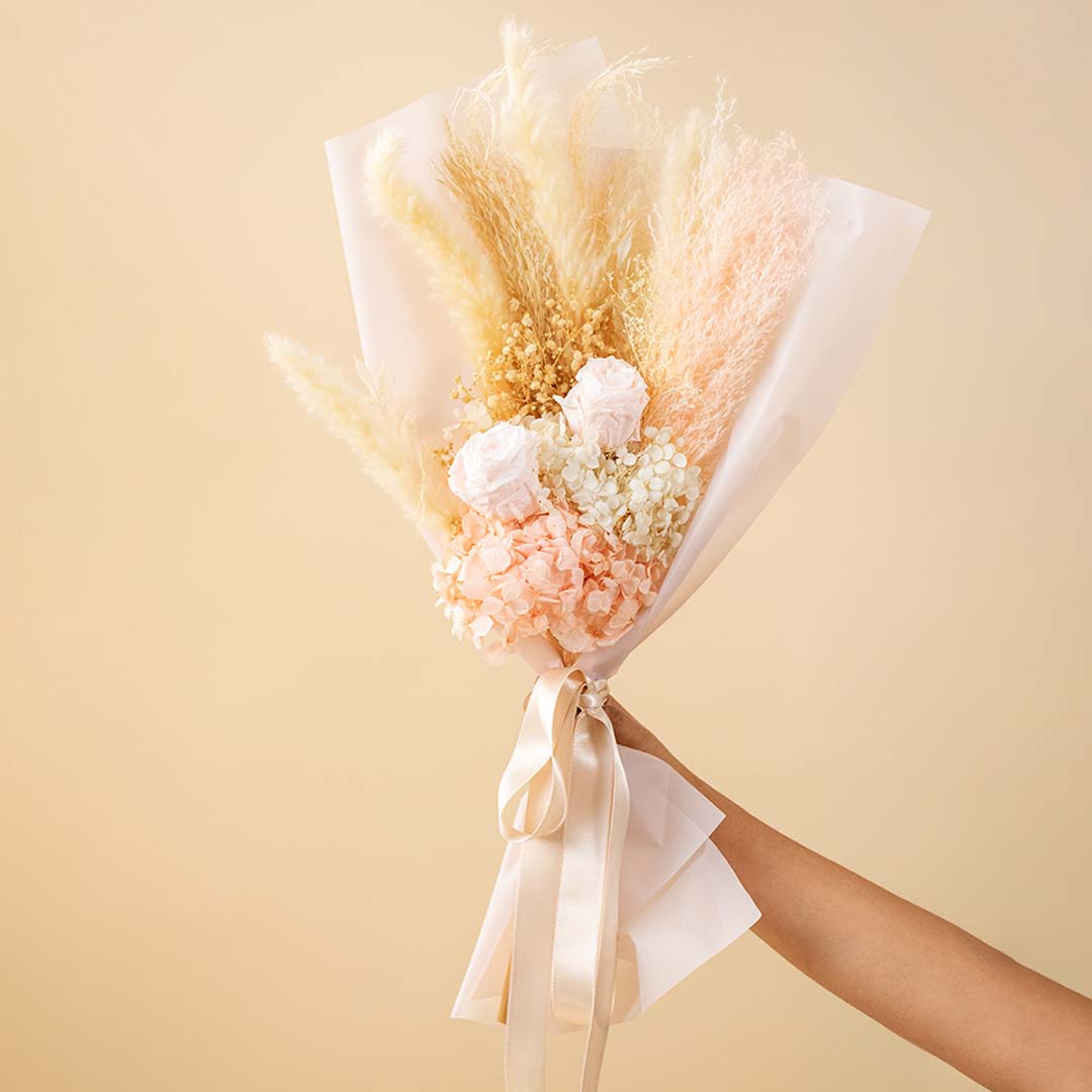 Pink Mania Flower Bouquet with pampas grass and cream roses in white wrapping