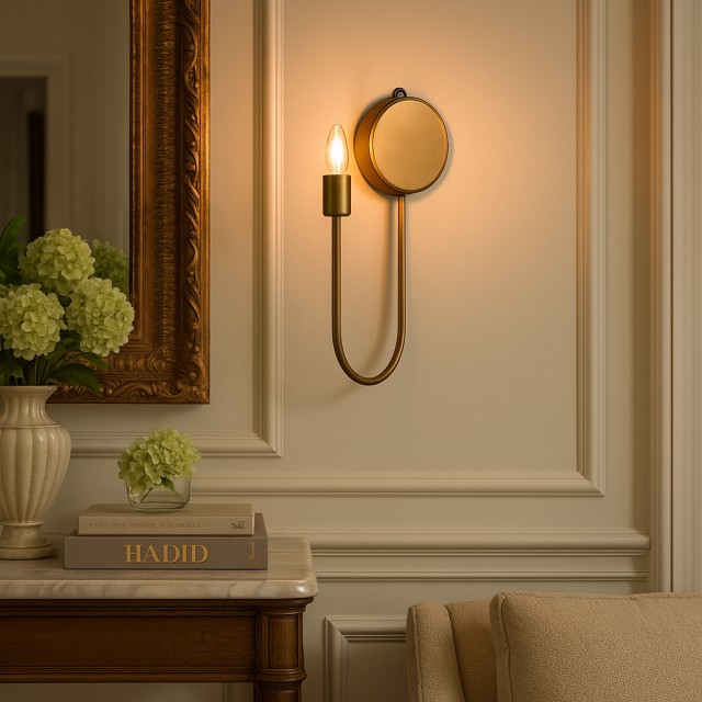 Elegant brass wall sconce with warm lighting