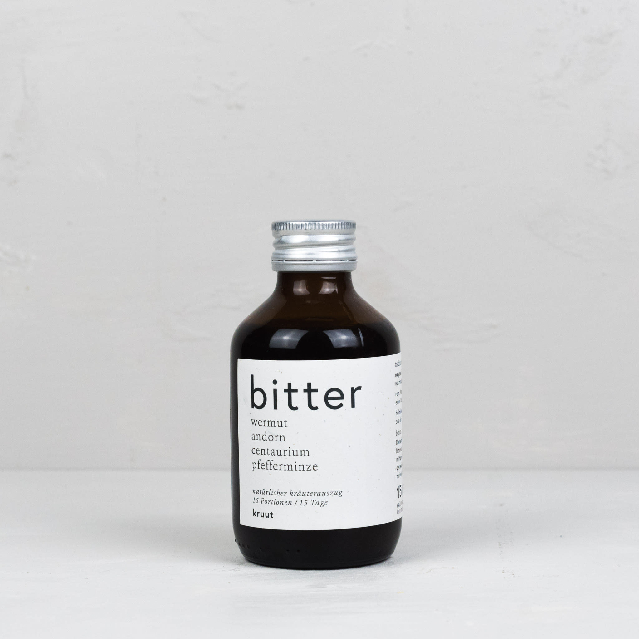 Flasche Wildkräuter in Honig und Essig