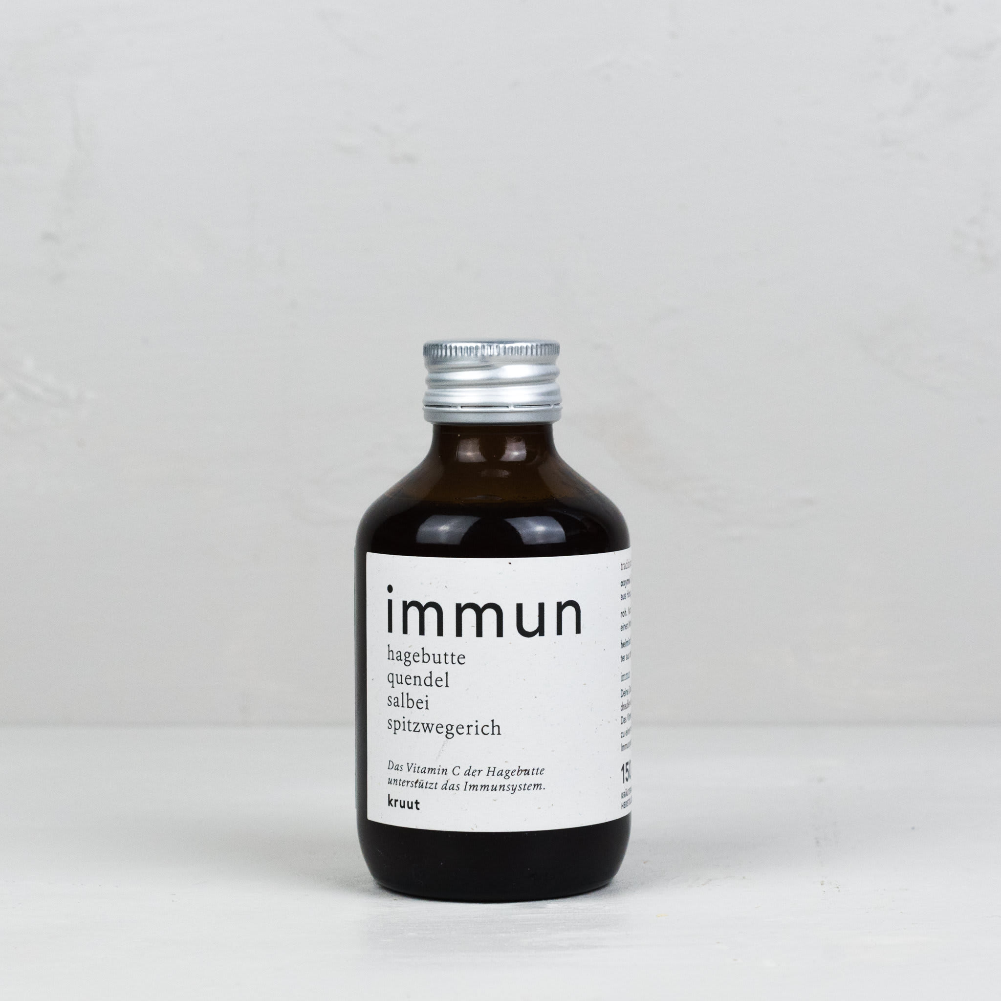 Flasche Wildkräuter in Honig und Essig