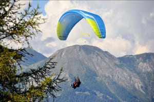 Tandem Paragliding flight over Neustift in Stubai Valley, near Innsbruck