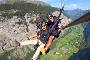 Tandem paragliding above Engelberg Valley, Switzerland 