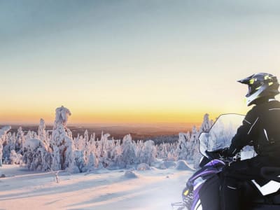 Sunrise Electric Snowmobile Tour to Hillsides near Rovaniemi