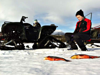 Ice fishing with coffee on a frozen lake starting from Åre