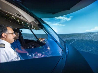 Flying a plane at the controls of a flight simulator in Toronto