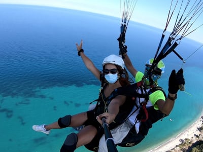 Tandem paragliding flight over Mount Olympus