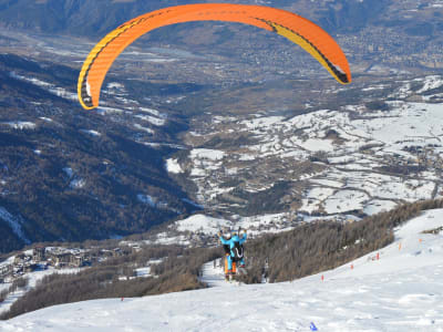 Winter tandem paragliding in Les Orres, Alps