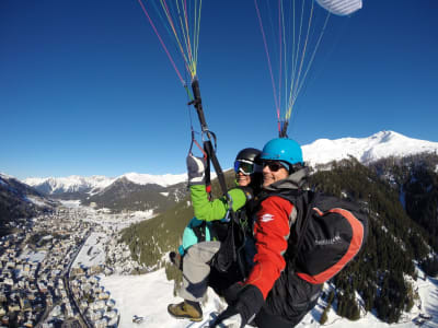 Winter tandem paragliding flight in Davos, Switzerland