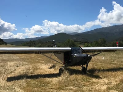 Multiaxis microlight flight over the Agriates from Corte