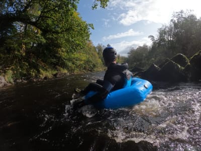 Tubing down The River Nith, near Galloway