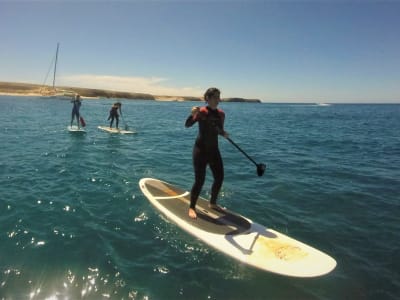 Excursión en Stand Up Paddle por la playa de Papagayo, cerca de Playa Blanca