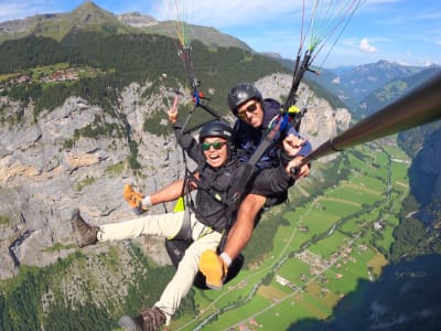 Tandem paragliding above Engelberg Valley, Switzerland 