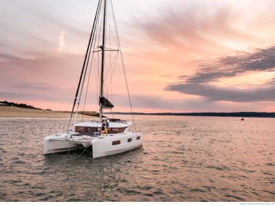 Catamaran cruise with aperitif in the Gulf of Aigues-Mortes at sunset from La Grande-Motte