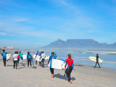 Learn how to surf at Big Bay Beach, Cape Town