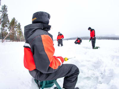 Ice Fishing on a Frozen Lake in Vuokatti