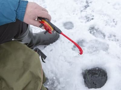 Lakeside Ice Fishing Experience near Rovaniemi