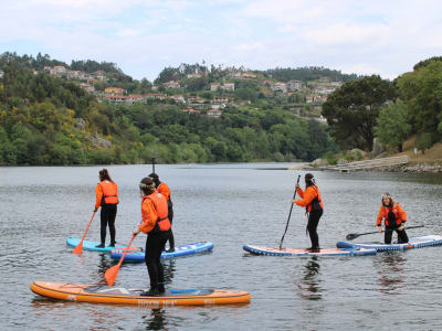 Stand-up paddleboarding on the Paiva River in the Arouca Geopark near Porto