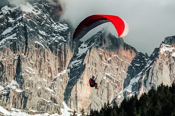 Winter Tandem Paragliding Flight over the Dolomites from Kronplatz