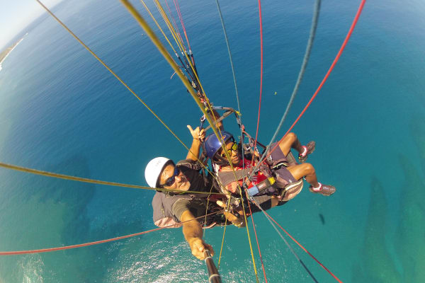 Paragliding flight at Saint-Leu's lagoon in Reunion Island