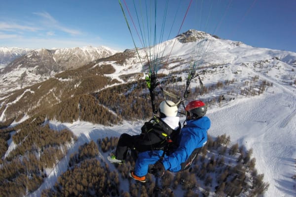 Winter paragliding experience near Lake Serre-Ponçon