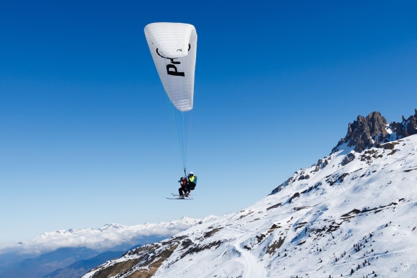 Tandem Ski Paragliding Flight in Méribel from the Summit of Saulire