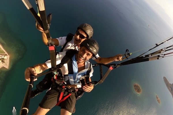 Tandem paragliding flight in the Gulf of Itea from Delphi