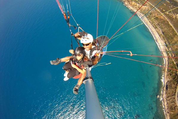 Tandem paragliding flight over Taormina from Letojanni, Sicily