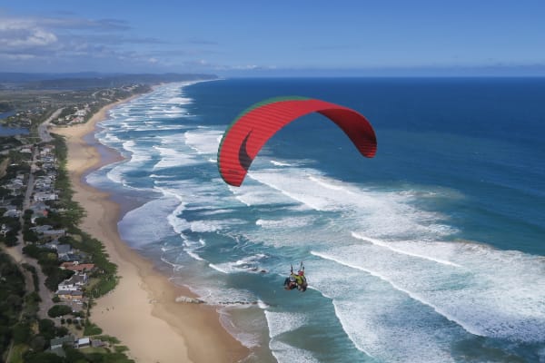 Tandem paragliding flight above South Africa’s Garden Route, from Wilderness