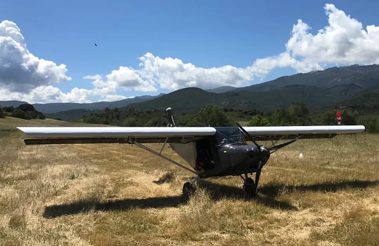 Multiaxis microlight flight over the Agriates from Corte