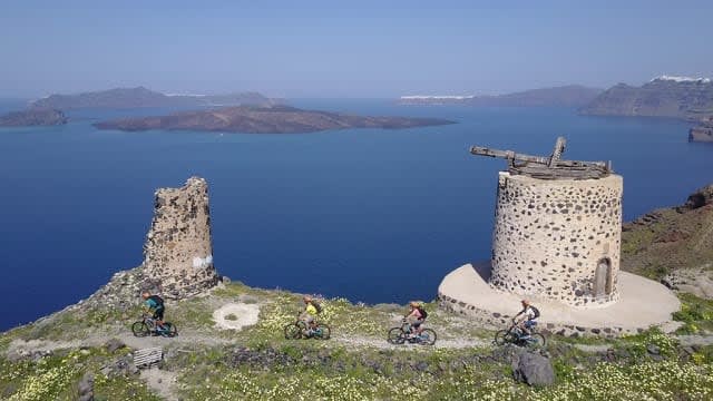 People biking on ruins