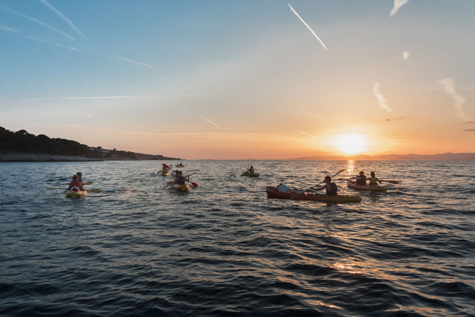 Kajakfahren bei Sonnenuntergang