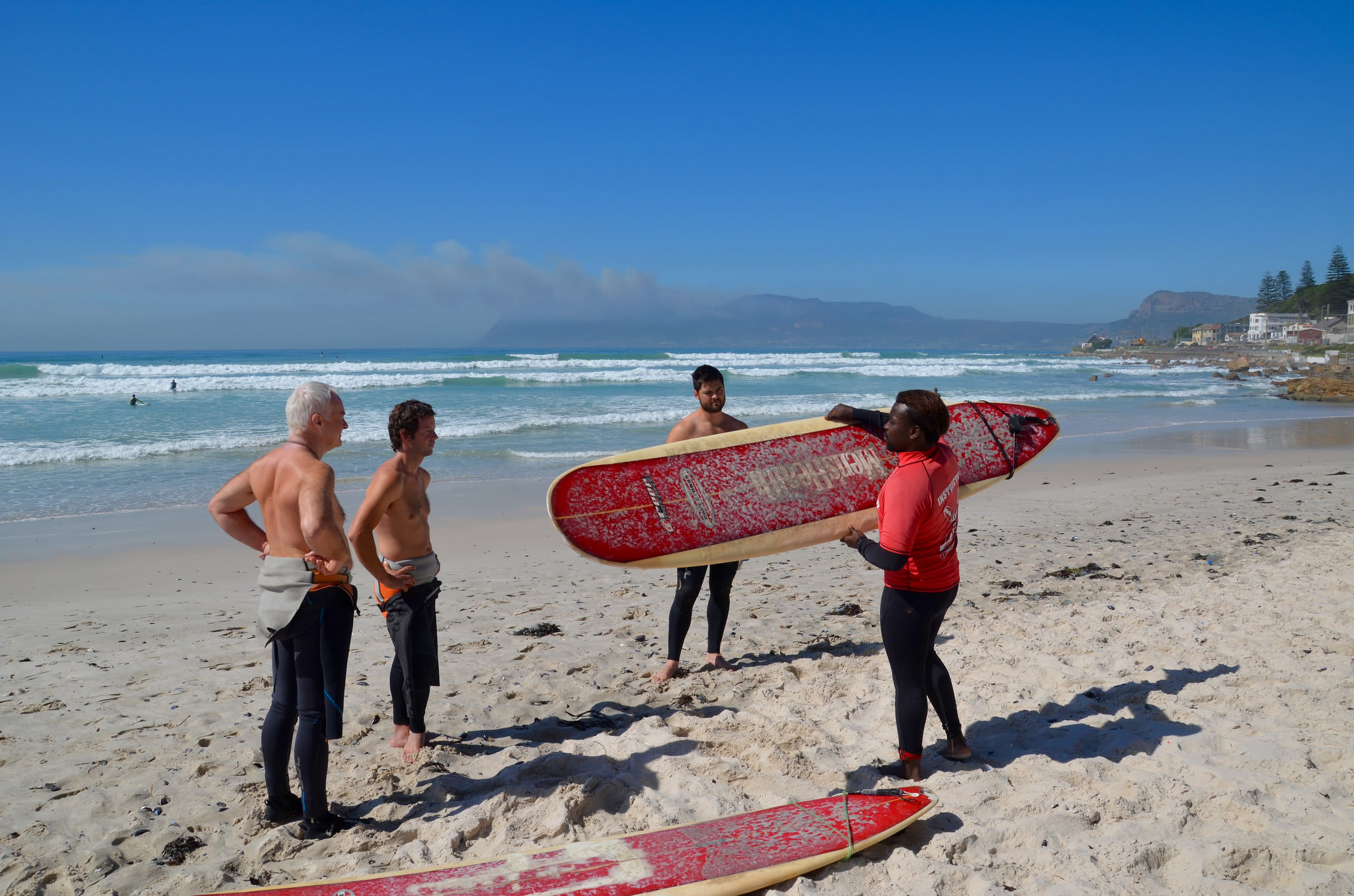 Group Session Surf Lessons in Muizenberg Beach, Cape Town Manawa