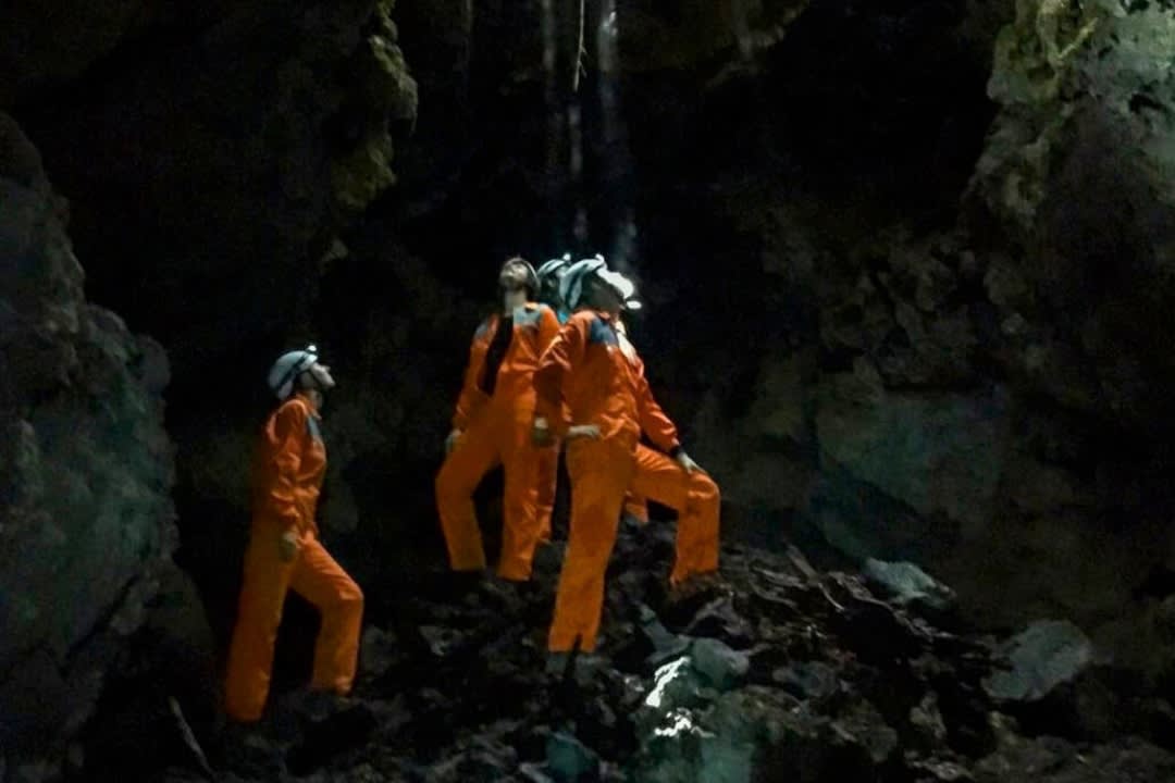 A grouo of people doing a Half-Day Caving Excursion around the Lava Tunnels of Ilha do Pico, Azores