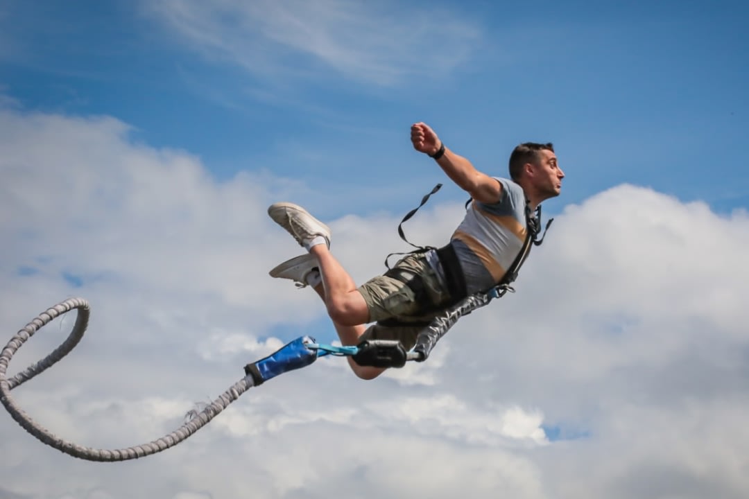 A man doing bungee jumping from the Viaduct Souleuvre