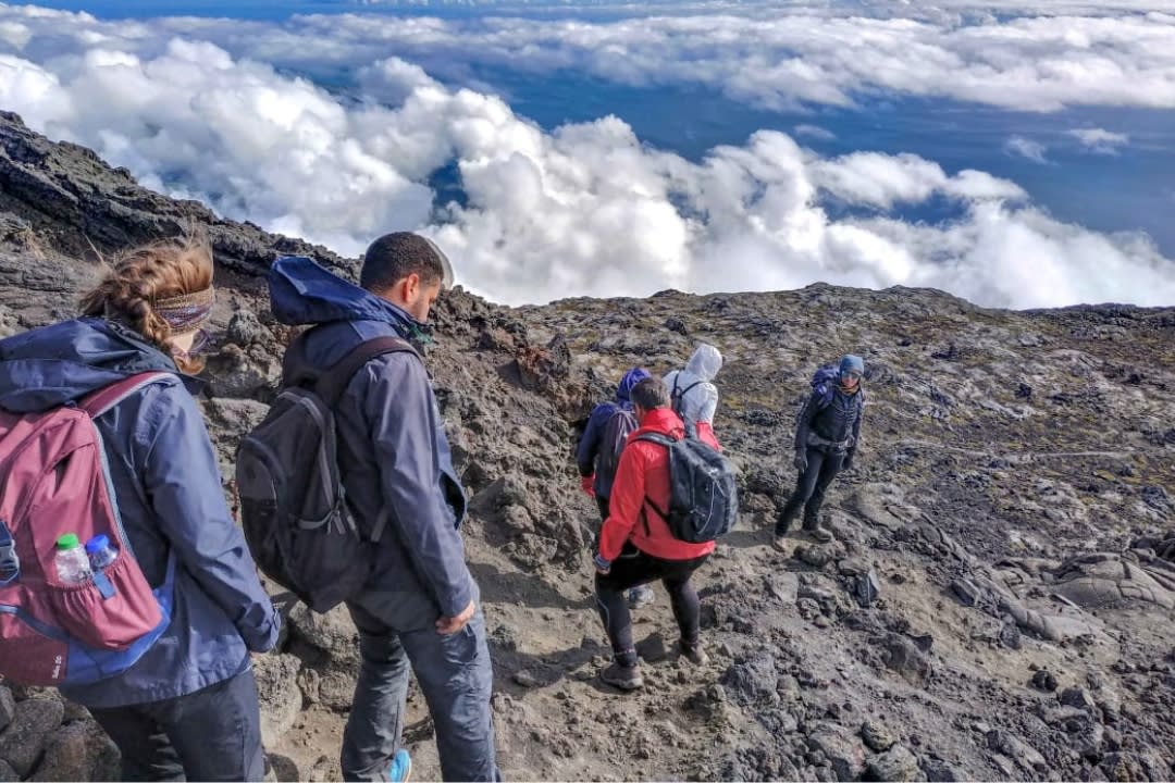 Group of friends doing hiking in Mont Pico, Pico