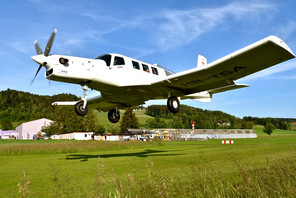 Skydiving plane in Swiss Alps