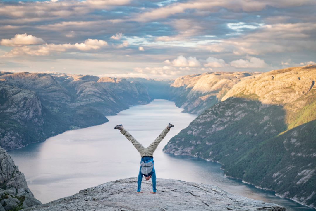 A man doing funny stuff in the pulpit rock
