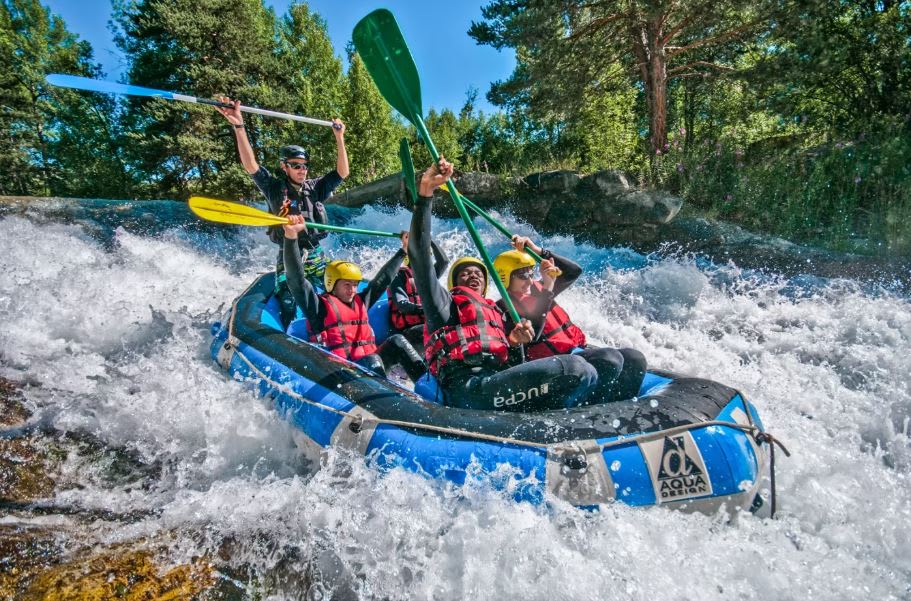 Group of friends doing rafting