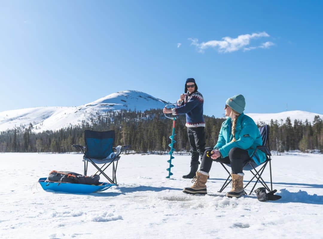 Ice Fishing on Lake Ylläsjärvi in Finnish Lapland