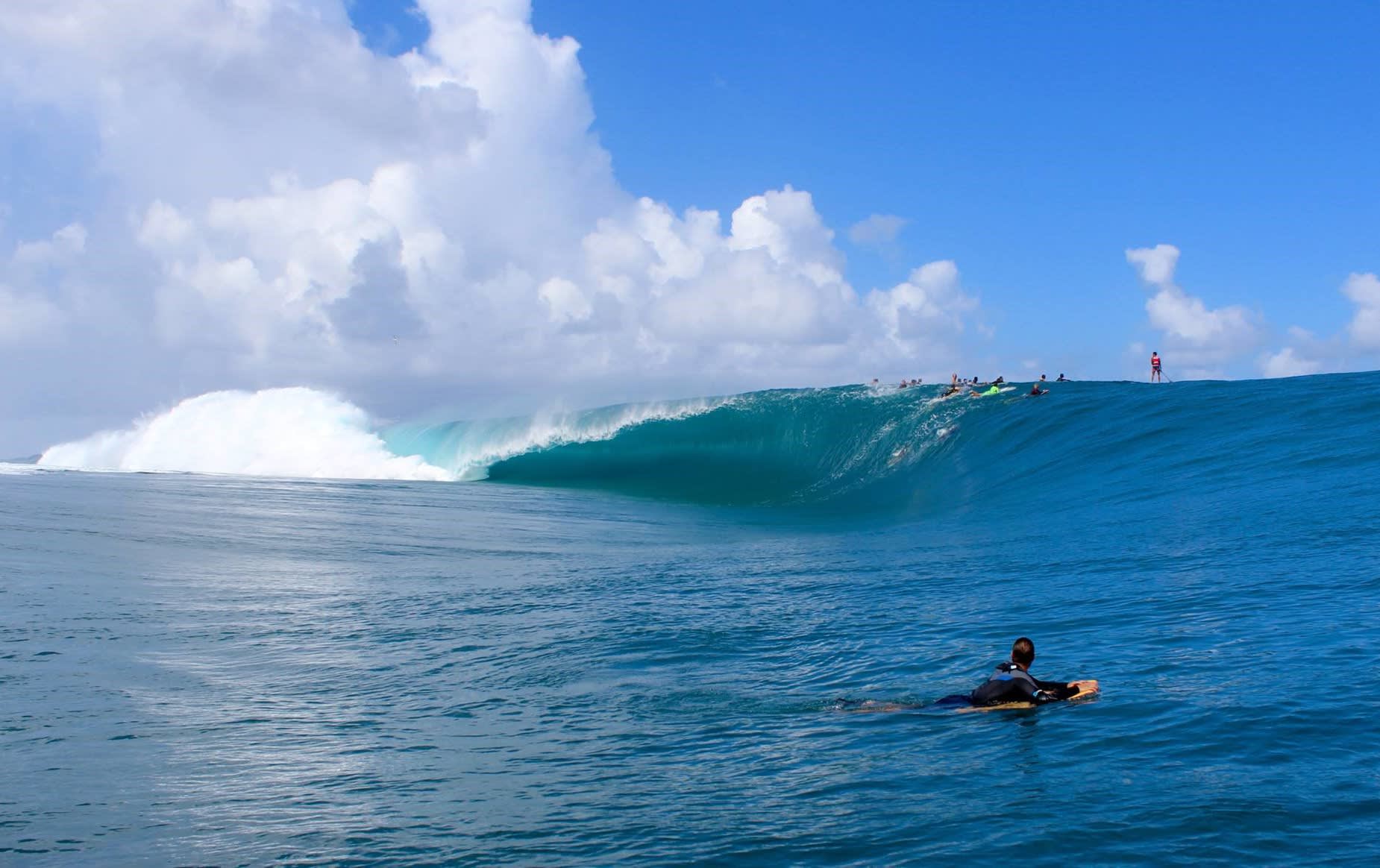 Surfing the Teahupoo wave in Tahiti