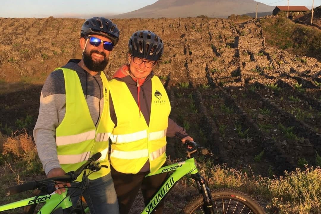 A couple doing a Biking Tour of the Vineyards in Ilha do Pico, Azores