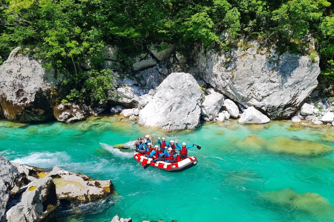 Friends doing Whitewater Rafting on the Soča river in Bovec