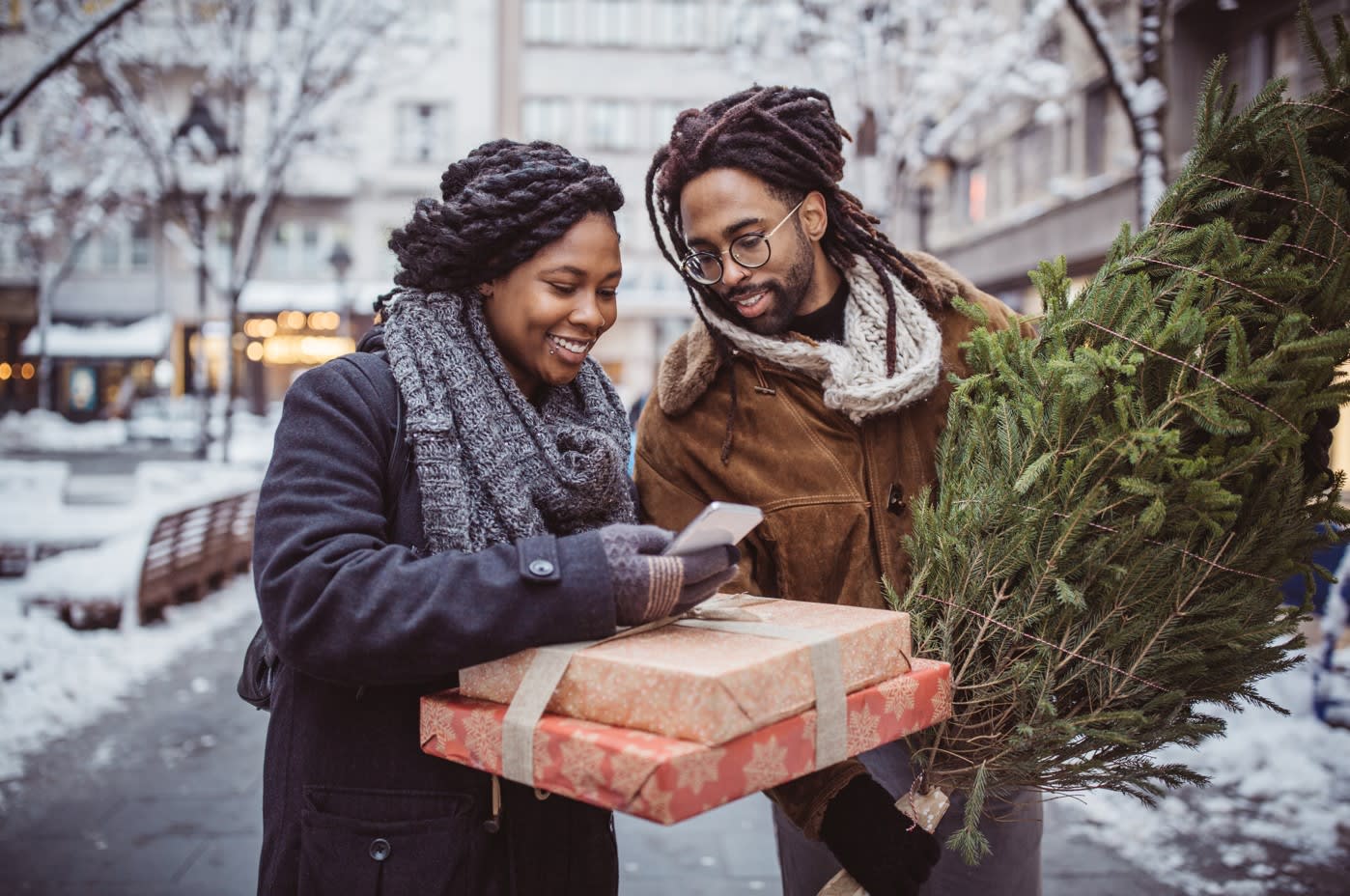 couple opening christmas gifts