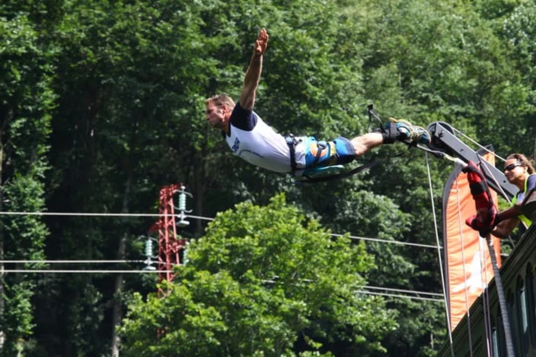 A man doing bungee jumping from the Napoleon Bridge in Luz Saint Sauveur