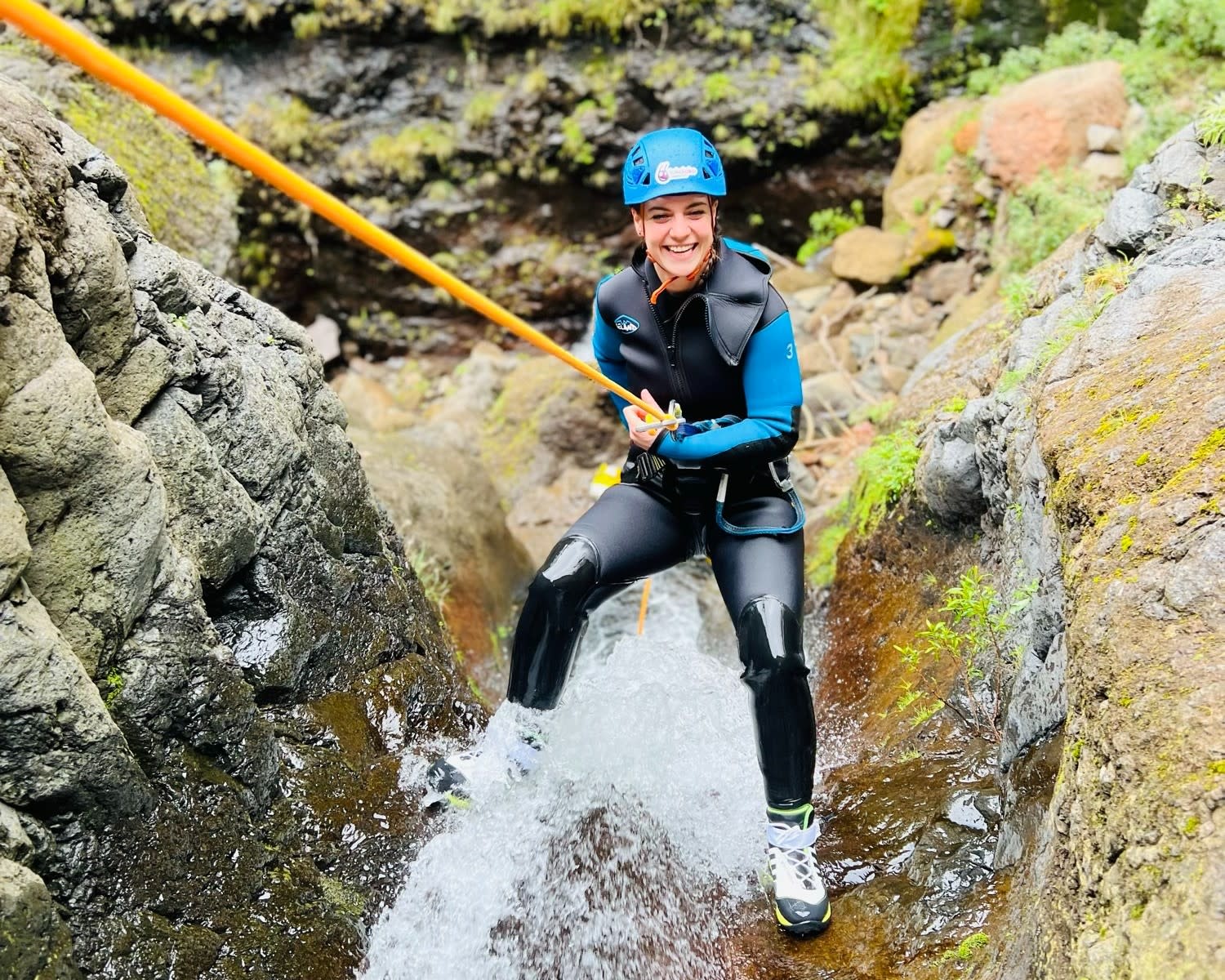 Woman abseiling while canyoning in Madeira