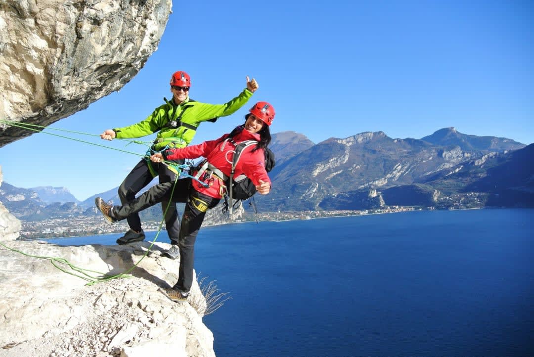 A couple doing Via Ferrata above Lake Garda