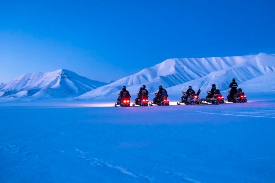 Snowmobile Safari to an Ice Cave from Longyearbyen in Svalbard