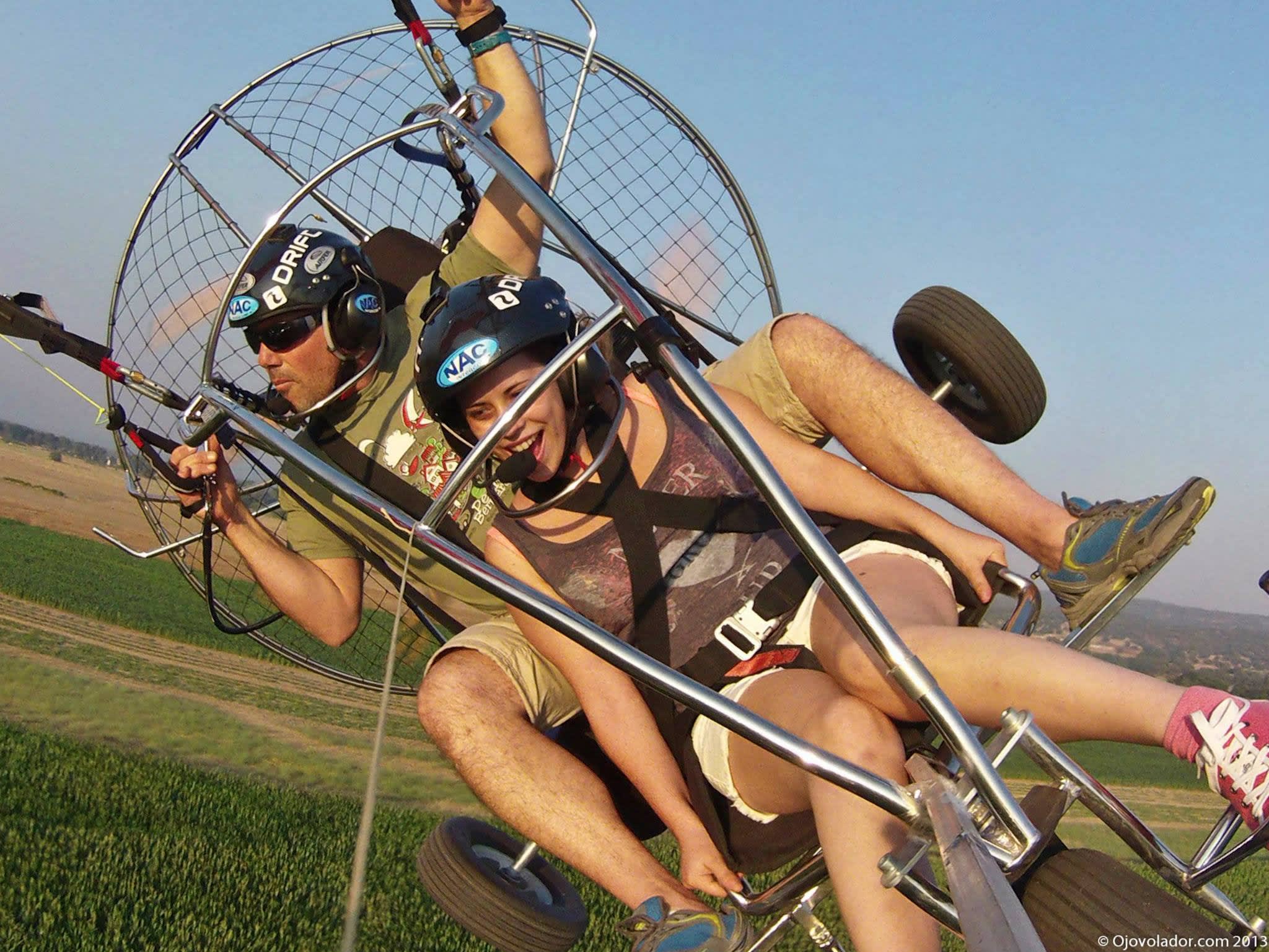 Two people on a paramotor